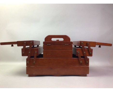 THREE VINTAGE SEWING BOXES, ALONG WITH A FOOTSTOOL the stool oak framed with rattan topthe largest box 45cm wide Qty: 4