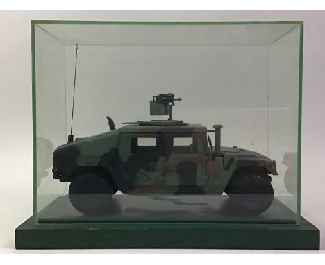 MODEL MILITARY COMBAT VEHICLE, AND FURTHER MILITARY MODELS the first in camouflage pattern, along with further figures of sol