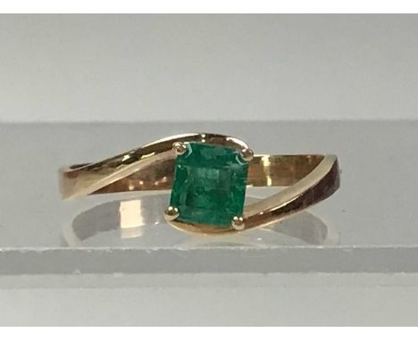 EMERALD SOLITAIRE RING, faintly marked 750, size R 1/2Qty: 3.6gThe emerald is half a carat, the ring appears to be in good co