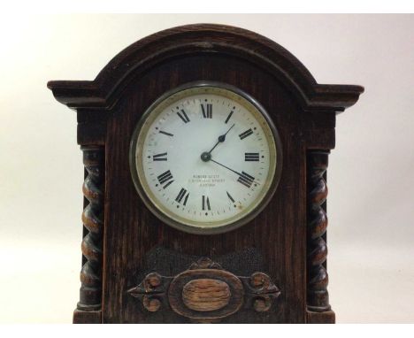 OAK CARRIAGE CLOCK, the white circular dial with Roman numerals 24.5cm high