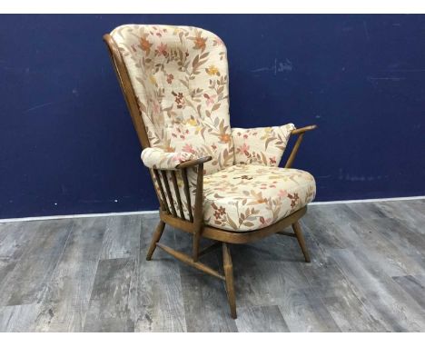 ERCOL ARMCHAIR, the cushions upholstered in cream with leaf designs