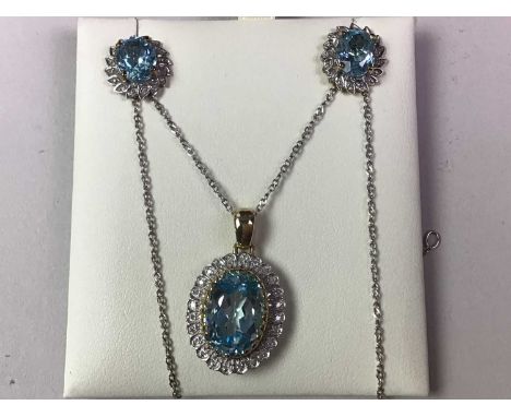 TOPAZ AND DIAMOND SUITE OF JEWELLERY, comprising ring, pendant and earrings, in nine carat gold, the chain silver