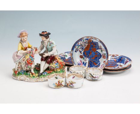 A DRESDEN STYLE PORCELAIN FIGURAL GROUP OF A YOUNG LADY AND HER GENTLEMAN COMPANION; a pair of Meissen ring handled two-pot s