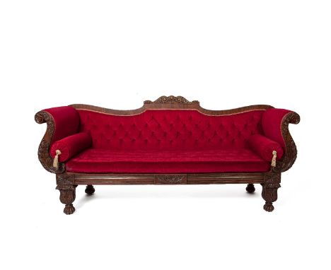 A WILLIAM IV MAHOGANY FRAMED DOUBLE SCROLL END SOFA WITH ARCHED BACK, the frame profusely carved with acanthus leaves, scroll