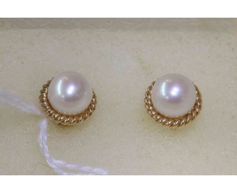 Pair of 14 carat gold and cultured pearl stud earrings