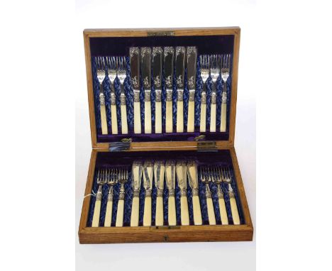 Cased set of twelve silver-plated and ivory handled fish knives and forks