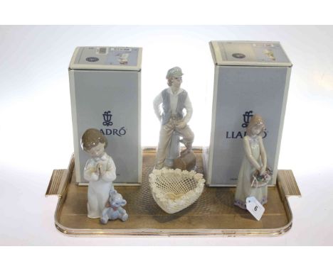 Two Lladro figures, boxed; Nao figure and a Belleek heart-shaped basket