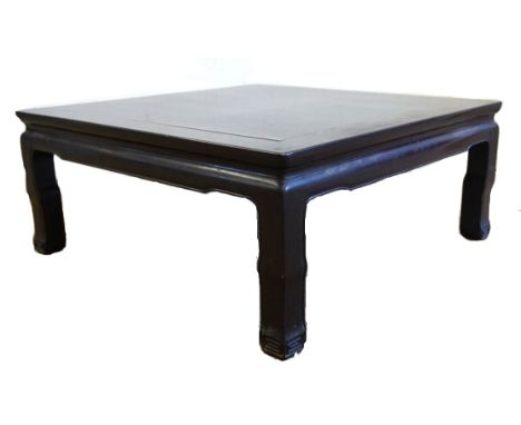 A Chinese Huanghuali style low table, Kang, 20th Century
The square plank top inset with mitred members , the exterior apron 