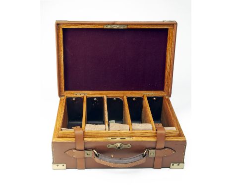A BRASS-CORNERED OAK AND LEATHER CARTRIDGE MAGAZINE,for approx. 250 cartridges, the interior lined with maroon baize, brass p