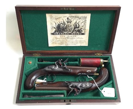 A cased pair of Flintlock pistols by Charles Moore. 15cm long octagonal rifled barrels, marked "London". Approx 15mm bore. Lo