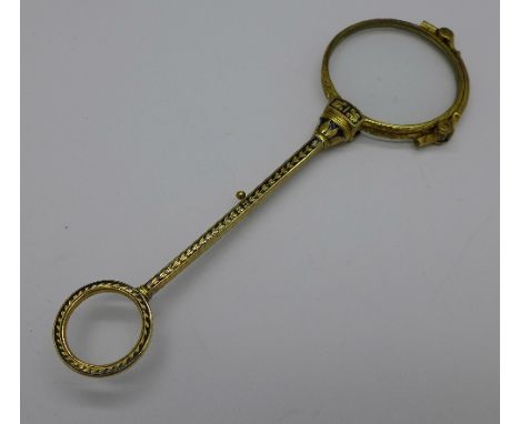 A pair of gold plated lorgnettes with blue enamel