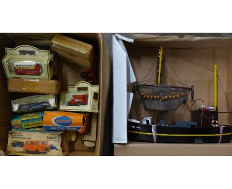 A model boat, Days Gone and Corgi The Saint die-cast vehicles, a Crescent artillery gun and an Anker clockwork camper van, bo