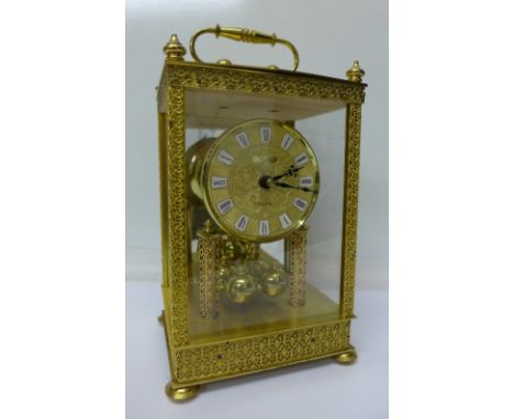 A Schatz brass and four glass sided quartz anniversary clock, height 23cm without handle