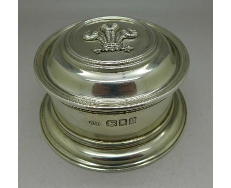 A silver circular lidded pot with fleur-de-lys lid,(table snuff), the base marked Crichton Bros., London & New York, 241g