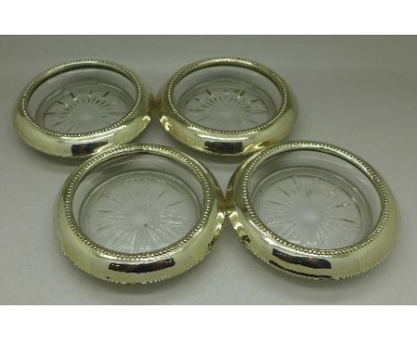 Four sterling silver mounted glass dishes