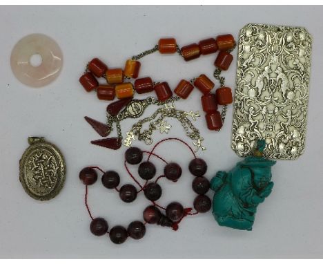 A silver bracelet, white metal locket, scent bottle, Chinese currency, etc.