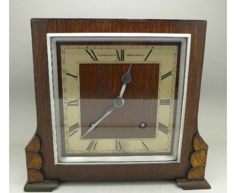 A Garrard oak cased mantel clock with striking movement, retailer Brown & Son Ltd., London & Sheffield, 20cm