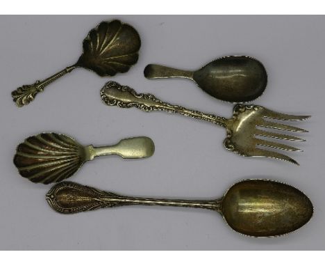 A silver spoon by George Adams, a silver fork, a silver caddy spoon and two other spoons