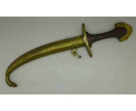 A Persian knife with brass scabbard