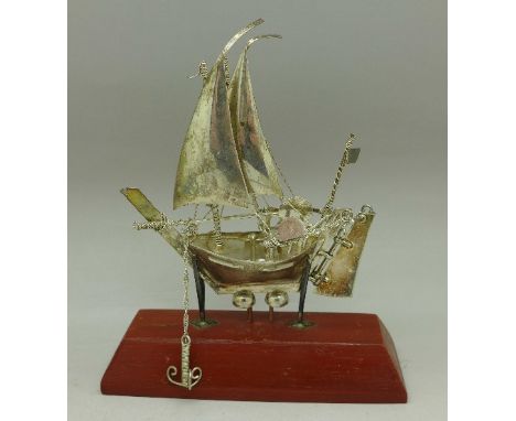 A silver model boat marked 925