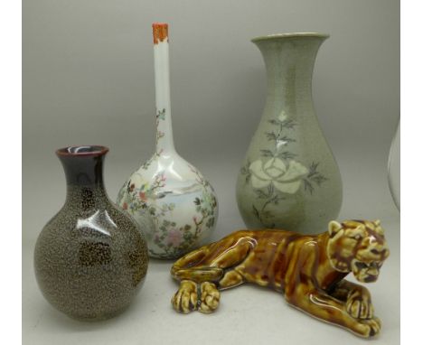 A Japanese bottle vase, a Korean vase, one other vase and a model lion