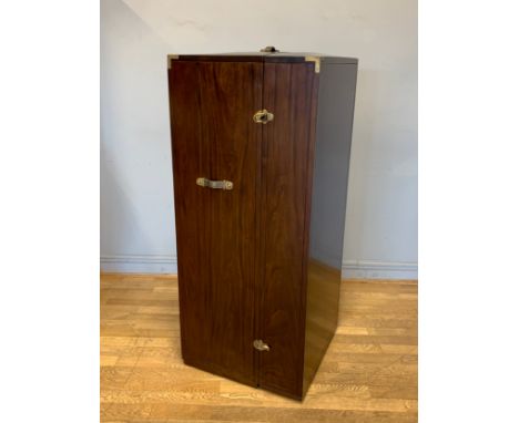 A solid mahogany Hamptons bar cabinet, in the form of a steamer traveling trunk, the hinged door opening to reveal a fully fi