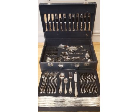 A Suissine 96 piece canteen of cutlery complete in fitted Hitachi case. 