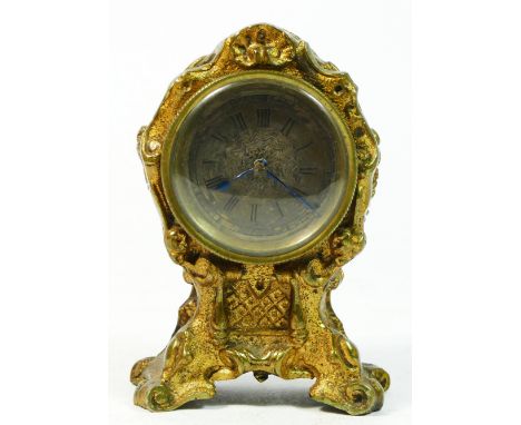 A George II style miniature gilt metal mantel clock, cartouche shape case, silvered dial with engine turning, single fusee ti