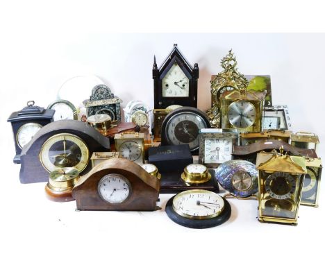 A collection of carriage clocks, mantel clocks, miniature novelty clocks and wall barometers, having manual and quartz moveme