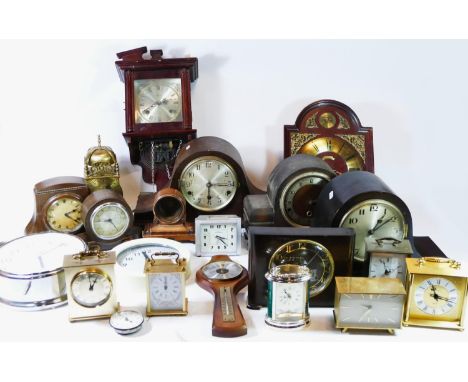 A collection of mid 20th century and later mantel clocks, lantern clocks and  carriage clocks, having manual wind and quartz 