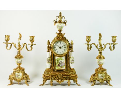 A French Louis XVI style gilt metal 3 piece garniture clock set, the case of architectural pagoda form, surmounted by a flora