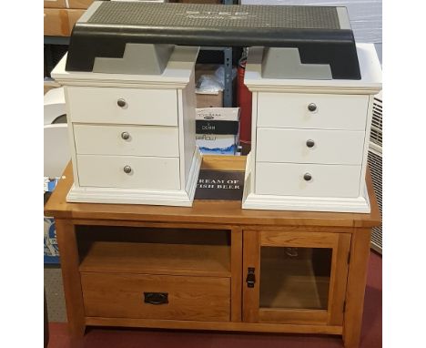 A modern Oak Furniture Land style TV cabinet, open aperture over a single drawer, next to a glazed hinged door, on bracket fe