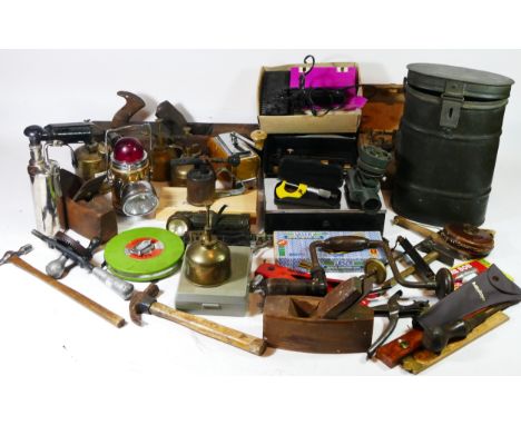 A collection of early 20th century and later hand tools, to include planes, pumps, oilers, measures, drills, blow torches, an