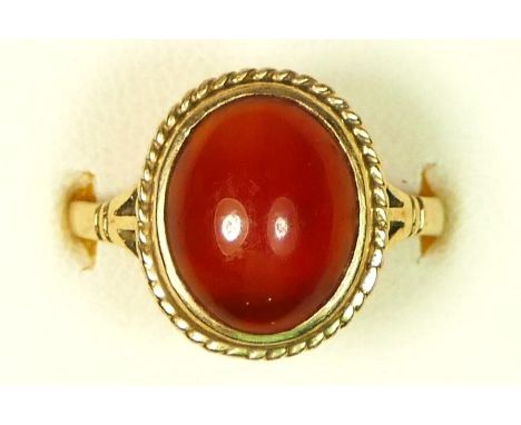 A vintage 9ct gold and cabochon cornelian single stone ring, 14 x 12mm, O, 2.7gm Very light surface scratches to the stone (c