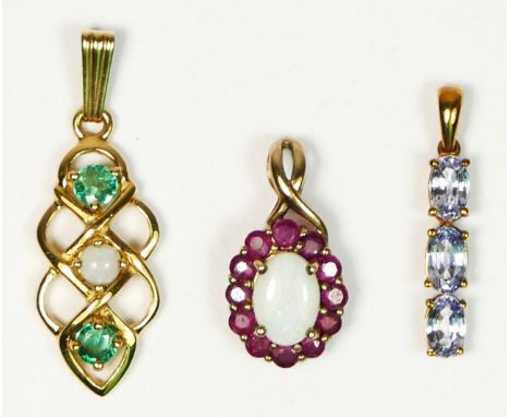 A 9ct gold emerald and opal pendant, an opal and ruby pendant and a sapphire pendant, 3gm 