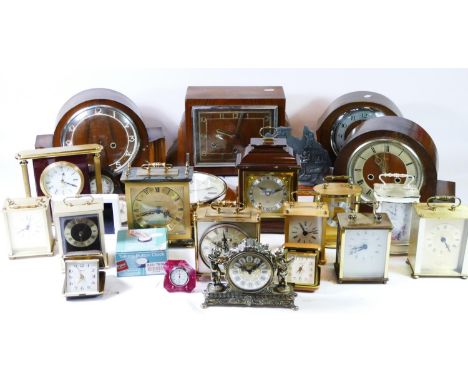 A collection of carriage clocks, mantel clocks, traveling alarm clocks, together with a quantity of clock movement parts. (4)