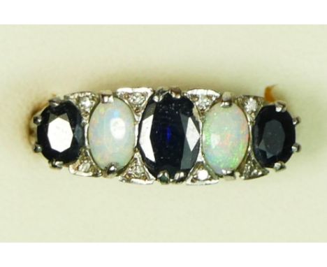 A 9ct white gold sapphire and opal five stone ring, diamond points between, carved claw setting, P, 4.6gm 