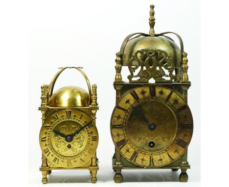 A Smiths mid 20th century brass cased lantern clock, having an 8 day movement, 23cm tall together with a smaller example, hav