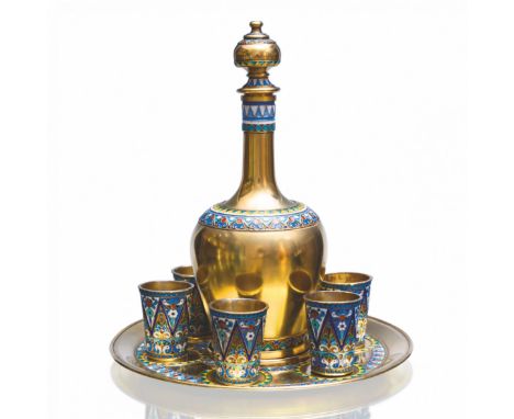 Russian silver vodka service with six enamel feet and a gilded decanter on a tray. Forms a complete and capacious ensemble of