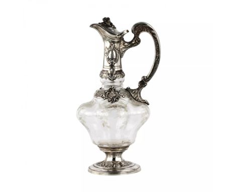 A graceful French wine jug in silver, the subject of subtle stylizations and allusions to the time of Henry of Nvarre. A pear