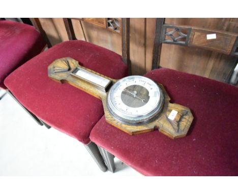 An early to mid 20th Century oak cased barometer