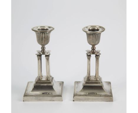  A pair of silver plated cluster column table candlesticks late 19th century, with fluted urn socles on four cluster columns 