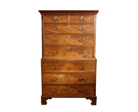  A George III mahogany chest on chest the step moulded cornice over two short and three long graduated drawers within fluted 