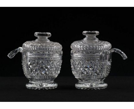  Two early 19th century cut glass piggins possibly Irish, the cup form bodies with dentil cut rim and diamond and prism cut d