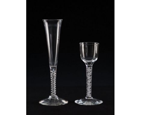  Two mid-18th century air twist glasses circa 1750, the first a wine glass with ogee bowl on multi spiral opaque twist stem c