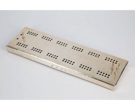  A Channel Islands silver cribbage board Bruce Russell of Guernsey, silver overlay on wood, bark effect hammered finish, with