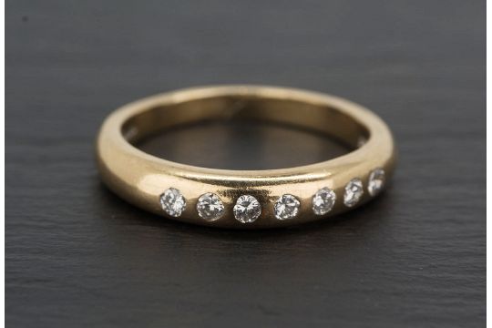 gold band with inset diamonds