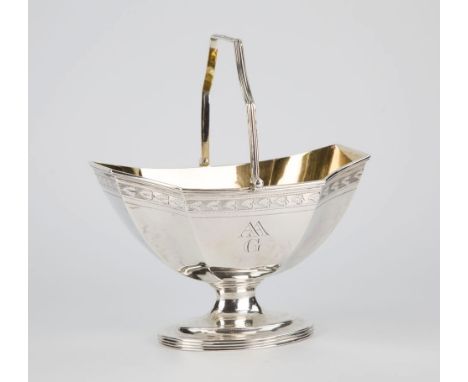  A good George III silver swing handled sugar basin Joseph Scammell, London 1795, of octagonal boat form with engraved foliat