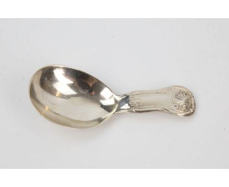  An Irish silver caddy spoon 19th century, no makers or date marks, waisted form stout handle with shell terminal, 3½in. (8.8