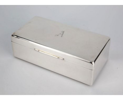  A George VI silver cigarette box Walker and Hall, Sheffield 1940, of plain rectangular form, centralised raised graduated th